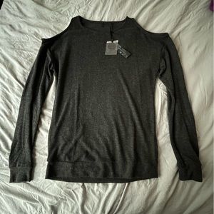 New W/O Tags. Shoulder Cap Revealing Black Long Sleeve.